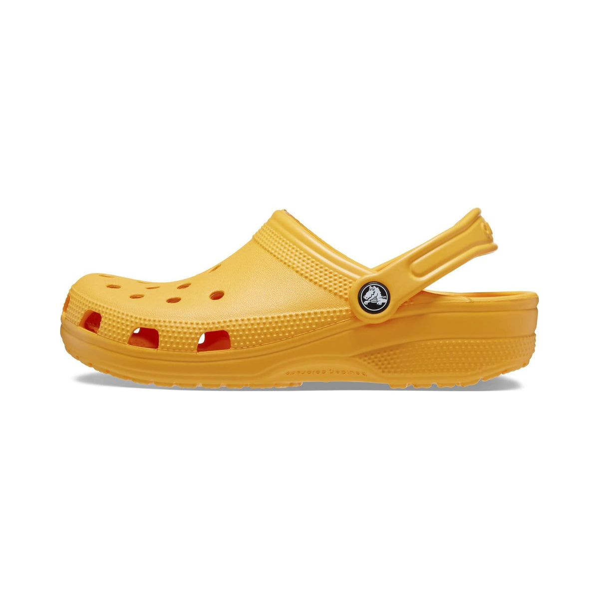 Crocs Classic Clog in yellow-orange, unisex slip-on clog shown from multiple angles